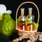 Aromatic spa concept of bottles essential oil in basket, flower,