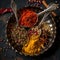 Aromatic spices on vintage spoons in rustic setting for culinary use. vibrant colors and textures. ideal for food blogs