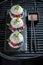 Aromatic sushi burger with berries and mascarpone on dark plate