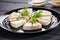 aromatic tofu steaks on a round stone plate