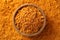 Aromatic turmeric powder and bowl, top view