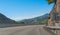 Around the bend - Sunshine on Spanish coastal highway. Foothills and mountain ranges on the edges of continental Europe in Spain.