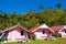 Arranged pink houses in front of a mountain