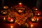 Arrangement of burning lamps and flower petals for Diwali celebrations