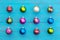 Arrangement of colorful Christmas balls on blue