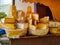 Arrangement of fresh cheese and aged yellow cheese shapes at the market