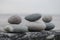 Arrangement of grey pebbles on a coastal wall at the beach