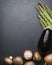 Arrangement of mixed vegetables on dark stone copyspace.