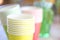 Arrangement of recycling disposable colorful paper cups, glass of red, yellow color