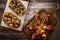 Arrangement of a selection of different tapas or bruschettas on a wooden board