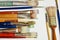 Arrangement of several artist`s paintbrushes placed at right angles