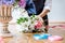 Arranging artificial flowers vest decoration at home, Young woman florist work making organizing diy artificial flower, craft and