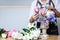 Arranging artificial flowers vest decoration at home, Young woman florist work making organizing diy artificial flower, craft and