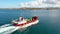 Arranmore, County Donegal, Ireland - August 31 2022 : The red Arranmore ferry leaving the Island towards Burtonport