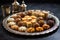 an array of arabic sweets on a silver tray