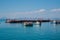 Array of boats docked near each other in the sea with the smaller boats situated on the shore