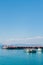 Array of boats docked near each other in the sea with the smaller boats situated on the shore