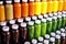 an array of bottled herbal supplements in various colors