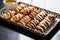 an array of coffee-infused eclairs on a zigzag-patterned tray