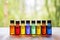 an array of colored essential oil bottles