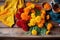 array of colorful marigold flowers on a wooden table
