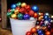 array of colorful ornaments nestled in a bucket, ready to be hung
