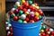 array of colorful ornaments nestled in a bucket, ready to be hung
