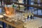 Array of glasses including champagne flutes, with other drinks on the bucket