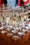 Array of sparkling crystal glasses filled with champagne atop a rustic wooden table