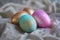 Array of Speckled Glitter Easter Eggs Nestled on Crumpled Linen, Evoking Cozy Springtime Elegance. Bright pink, blue and