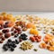 Array of vibrant and colorful dried fruits artfully arranged on a white table top