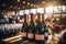 An array of wine bottles neatly arranged on a rustic table at a serene setting