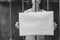 An arrested girl holds an empty sheet of paper in prison.