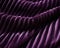 An arresting closeup of a deep purplemagenta corduroy fabric with its distinctive ridges and ooves. Trendy color of 2023