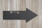 Arrow chalkboard sign with a skeleton key on weathered wood