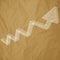 Arrow charts white scribble on a crumpled paper brown background.