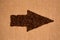 Arrow from the coffee beans on burlap