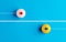 Arrow icons in contrast on table tennis balls moving towards opposite directions