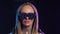 Arrow LED goggles woman looking at camera. Hypnotic blonde female pigtails 4K.