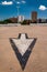 Arrow in parking lot and view of highrises from a parking garage