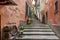 The arrow passage with steps in ancient village of Monterosso al Mare in Cinque Terre coastal area. Liguria region in Italy