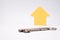 Arrow pointing up next to a key, symbolic image for incrising price and real estate market