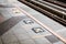 Arrow symbol or sign on platform in the queue waiting for the sky train.