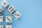 Arrow up. White gaming dices on light blue background. victory chance and lucky. Flat lay style, place for text. Top view and