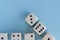 Arrow up. White gaming dices on light blue background. victory chance and lucky. Flat lay style, place for text. Top view and