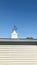 Arrow Weathervane, against the clean blue sky. Vertical photo image.