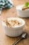 Arroz con leche. Rice pudding with cinnamon on wood