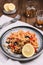 Arroz con verduras y azafran, spanish dish. Vegetarian risotto with  vegetables, champignons and saffron