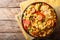 Arroz Valenciana with rice, meat, sausage, raisins, vegetables a