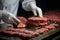The art of butchery unfolds as skilled hands process flavorful hamburger patties